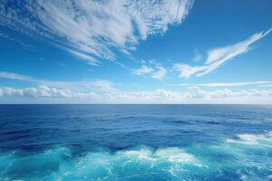 water and waves under fluffy white clouds on the ocean, photo