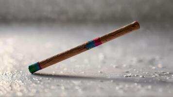 an odd colored toothbrush on top of icing, photo