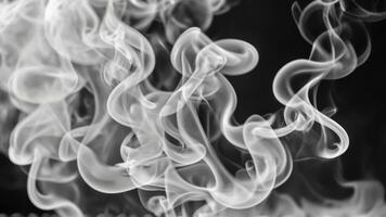 smoke swirls across a black background like the form of a woman standing by her, photo