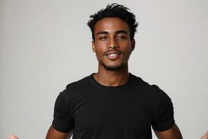 young man smiling and making funny faces with hands on plain background, photo