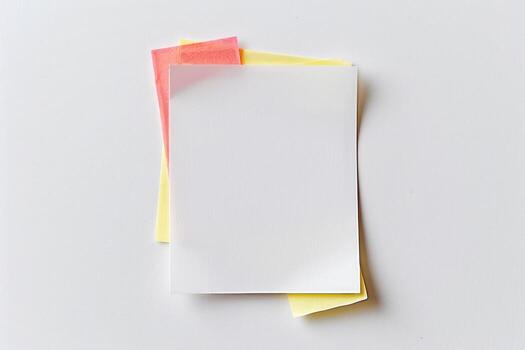 stacked paper notes on white countertop with pink paper, photo