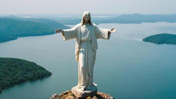 the statue looks out over a body of water, photo