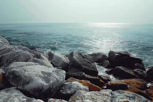 view from the side of large rocks at beach, photo