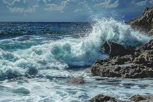 the waves crashing onto some rocks in the ocean, photo