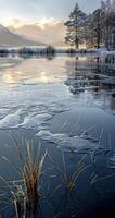 frozen water in a lake by some mountains, photo