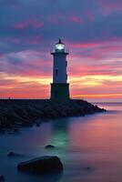 sunset scene at lighthouse with colorful sky behind, photo