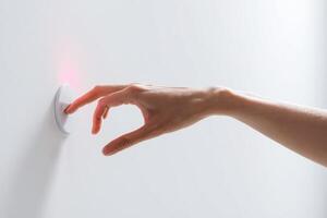 a person is using a hand on the button to pick something, photo