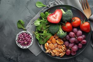 the plate is filled with fruits and vegetables, photo