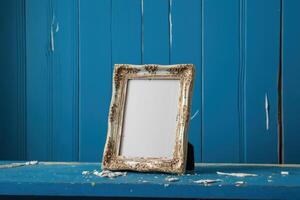 a wooden picture frame sitting on top of blue boarders, photo