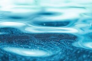 the surface of bright blue water with sparkling droplets, photo