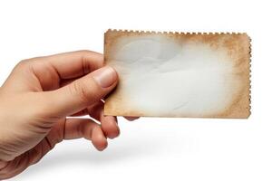 someone holding a piece of old paper in their hand, photo