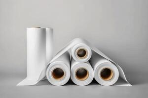 several rolls and a tube with a plastic wrapper sticking out of it, photo