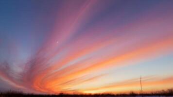 the brightly colored clouds on this sunset show, photo
