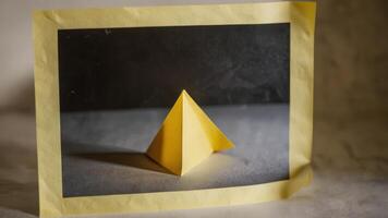 an unusual paper sculpture that is on the table, photo
