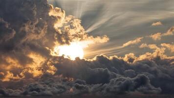 the sun is setting over some clouds, photo