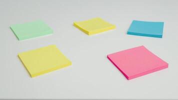 colorful sticky paper stickers sitting on top of white surface, photo