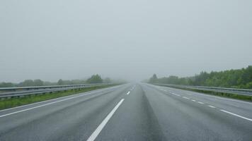 an empty highway that has white lines, photo