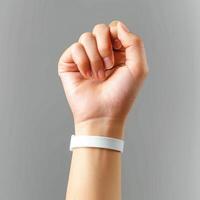 a woman is wearing her wrist band with a smart watch on that includes an id slot, photo