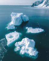 the ice is broken into pieces and floating in the water, photo