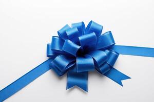 the bow is blue in color with a ribbon knot around it, photo