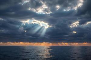 sunsets in the clouds over an ocean, photo