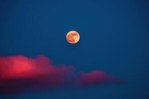 the full moon rising over the clouds, photo