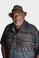 this is an old man in a hat and striped shirt, photo