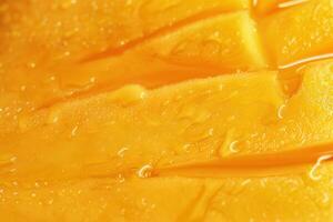 water droplets forming on a slice of mango fruit, photo