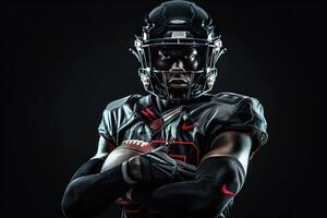 a football player posing for the camera wrapped in a black helmet, photo