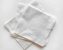 three white napkins on top of each other, photo