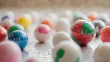 many shiny and vibrant candies surrounded by smaller chocolate eggs, photo