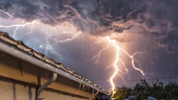 multiple lightning strikes over the roof of an apartment, photo