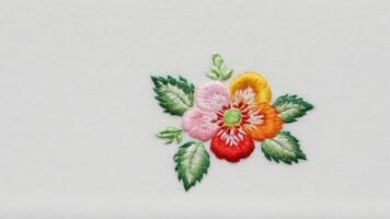 a white piece with colorful flowers on it, photo