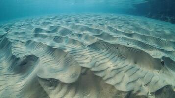 the ocean water is full of ripplers and sand, photo
