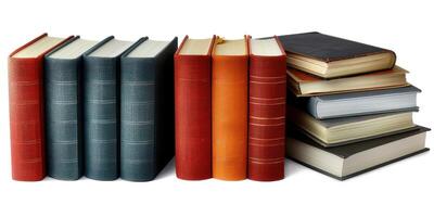 several old books sit together on a white table, photo