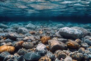 the sun is shining over some rocks on the ocean floor, photo