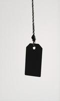 tag hangs on string in the air, with clip, photo