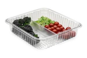 a white table topped with two plastic containers and vegetables, photo