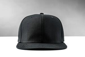 a black baseball hat on a white table, photo