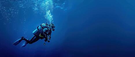 man on diving gear in very deep ocean waters, photo