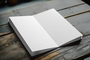 an open book sitting on top of a wooden table, photo