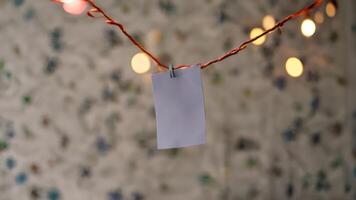 a picture of a piece of paper hanging from the side of an electrical cord, photo
