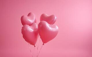 four metallic heart balloons with many pink ones in the same, photo