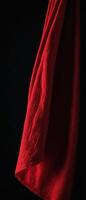 red cloth hanging from the back of a chair, photo