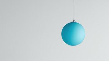 the blue balloon is hanging from the light strip, photo