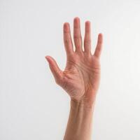 a person reaching up to put something in the air, photo