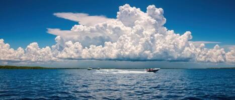 four small boats sailing on a lake under stormy skies, photo