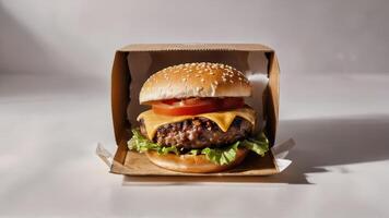 a hamburger is in a brown box with cheese and peppers, photo