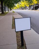 sign on sidewalk for street view at intersection, photo