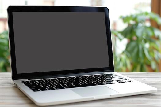 an open mac laptop sitting on a table, photo